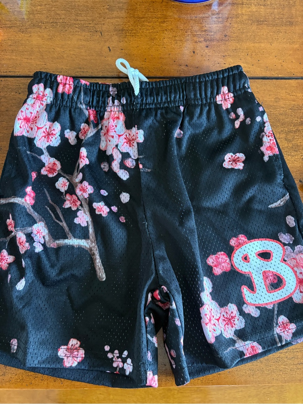 Boys Black Floral Athletic Shorts with Pink Blossom Accent